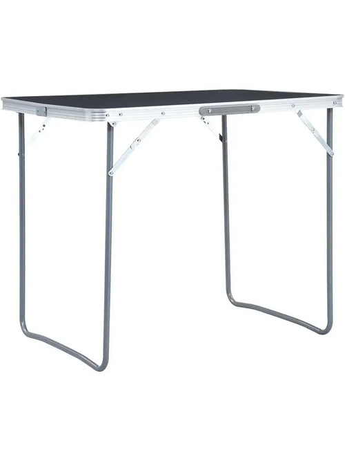Petite table de camping pliante en aluminium et MDF 80 x 60 cm devant une tente