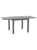 Table à manger extérieur pliante extensible en aluminium sur une terrasse