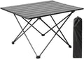 Table basse pliante de camping en aluminium 40 x 40 cm devant une tente