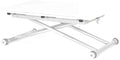 Table basse pliante relevable en position haute avec plateau étendu dans un salon