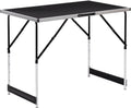 Table pliante réglable jusqu'à 90 cm de hauteur en position haute